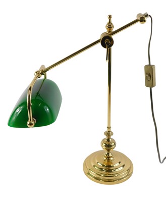 Lot 173 - A brass and green glass desk lamp, 50cm high.