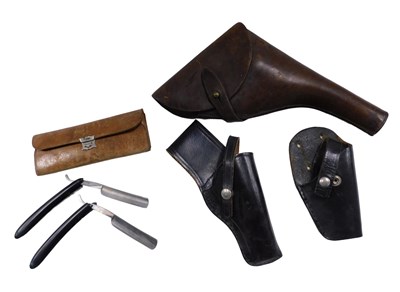 Lot 638 - Three leather gun holsters, and two leather...