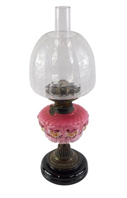 Lot 179 - A 19thC oil lamp, with a mottled shade, a...
