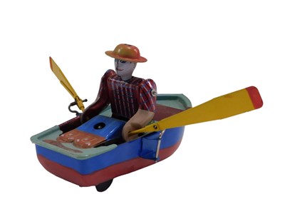 Lot 649 - A Chinese tinplate clockwork rowing boat...