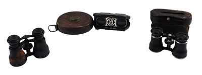 Lot 654 - Three sets of field glasses, comprising one...