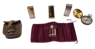 Lot 664 - Three Dunhill lighters, and a cased brass...