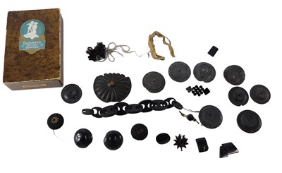 Lot 577 - A group of loose jet pieces, carved buttons,...