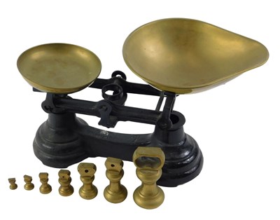 Lot 254 - A set of Librasco cast iron table top brass...