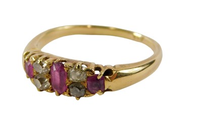 Lot 81 - A ruby and diamond dress ring, set with three...