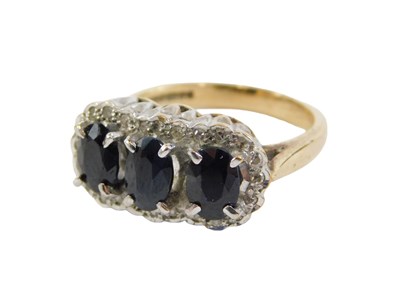 Lot 92 - A 9ct gold dress ring, set with three oval...