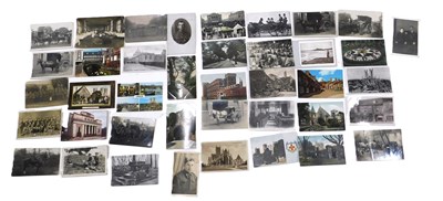 Lot 629a - A collection of postcards, to include black...