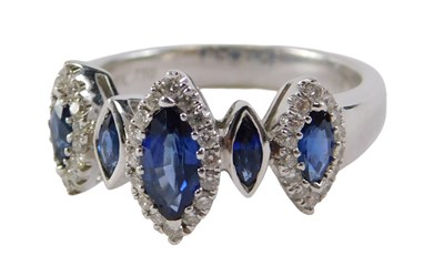 Lot 38 - An 18ct white gold sapphire and diamond dress...