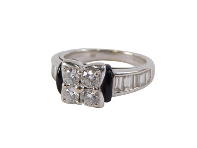 Lot 34 - An 18ct gold diamond cluster ring, set with...