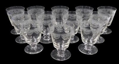 Lot 701 - A set of twelve 20thC glass rummers, each...