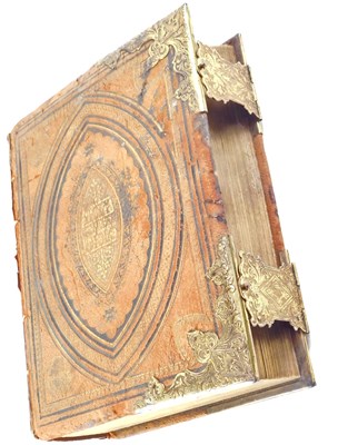 Lot 263 - A leather and gilt bound holy bible, coloured...