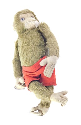 Lot 268 - A 20thC plush jointed mohair monkey, 26cm high.