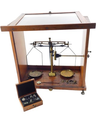 Lot 280 - A walnut cased set of chemists or lab scales,...
