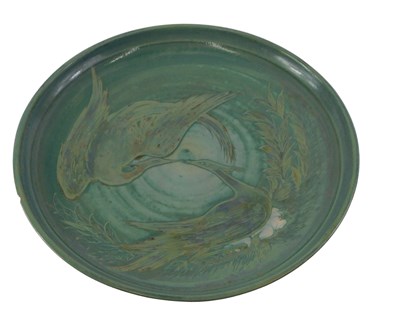 Lot 728 - A studio pottery charger, decorated with two...