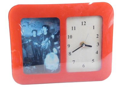 Lot 289 - A Beatles commemorative clock, in red glass...