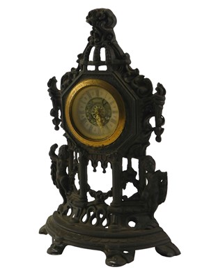 Lot 290 - A Continental cast metal clock, 23cm high.