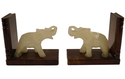 Lot 746 - A pair of soapstone bookends, each mounted...