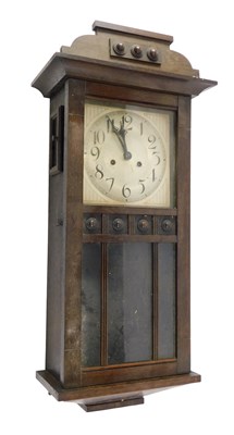 Lot 757 - An early 20thC oak cased wall clock, the...