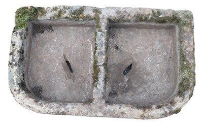 Lot 766 - A hewn stone D shaped trough, with two...