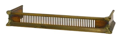 Lot 797 - A pierced brass fender or fire curb, 76cm wide.