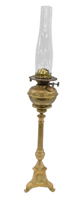 Lot 800 - A Continental brass oil lamp, with reeded...