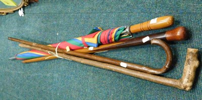 Lot 2253 - Three wooden walking sticks, and a...
