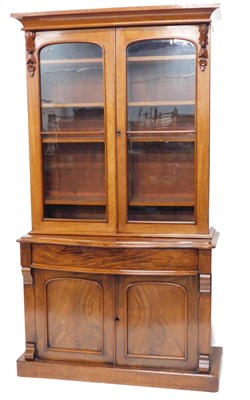 Lot 875 - A Victorian mahogany bookcase, the top with a...