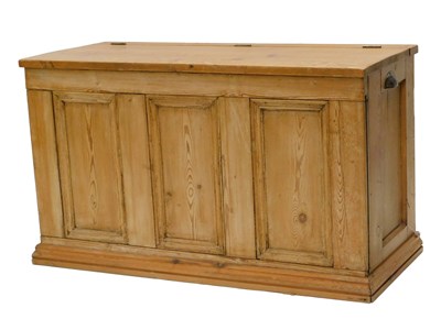 Lot 907 - A stripped pine chest, the hinged lid...