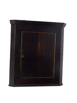 Lot 882 - A small mahogany wall mounted corner cabinet,...