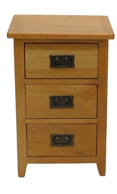 Lot 885 - A light oak chest of drawers, with three...