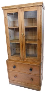 Lot 913 - A stripped pine bookcase, the associated top...