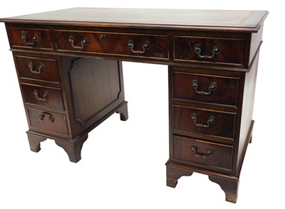 Lot 954 - A mahogany pedestal desk, the rectangular top...