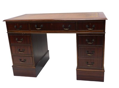 Lot 957 - A mahogany pedestal desk, the rectangular top...