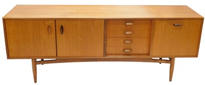 Lot 969 - A 1970s G-Plan teak sideboard, with four...