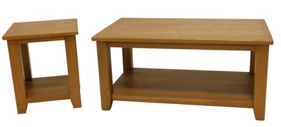 Lot 983 - A light oak two tier coffee table, on square...