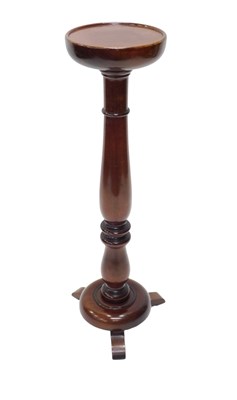 Lot 934 - A turned mahogany torchere, the circular...