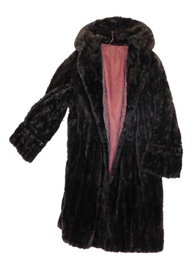 Lot 862 - A lady's Astrakhan fur coat, with maroon lining.