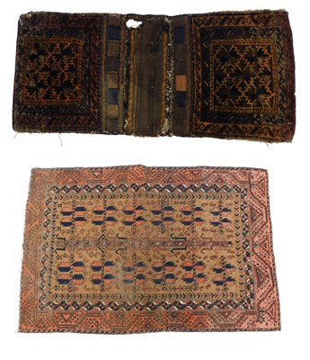 Lot 1015 - A Turkoman rug, with a geometric design, on a...