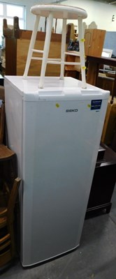 Lot 1517a - A Beko A+ Class fridge and a painted stool.