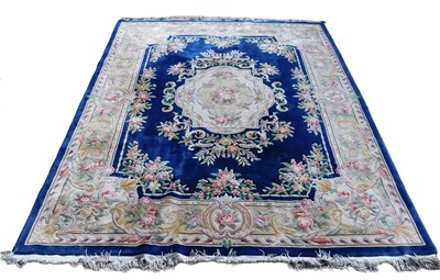 Lot 1020 - A Chinese cut wool carpet, with a design of...