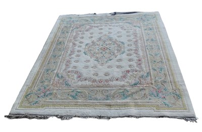 Lot 1021 - An Indian carpet, with a design of flowers and...