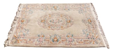 Lot 1023 - A Chinese cut wool small carpet, with a design...