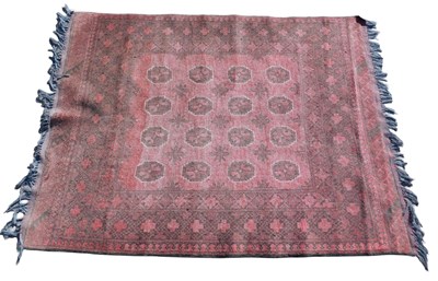 Lot 1027 - A Belouch type rug, with a design of four rows...