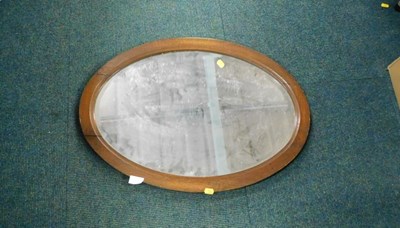 Lot 2158a - An oak framed oval wall mirror, 68cm x 48.5cm.