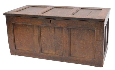 Lot 940 - A late 17thC panelled oak coffer, the hinged...