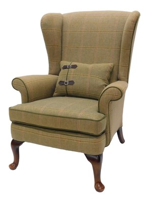 Lot 984 - A green tweed upholstered wing back chair, the...