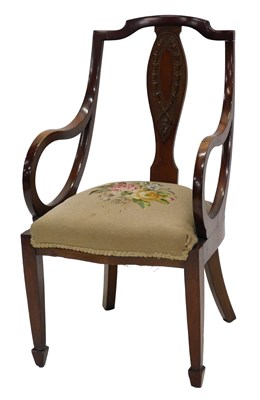 Lot 999 - An Edwardian mahogany small open armchair, the...