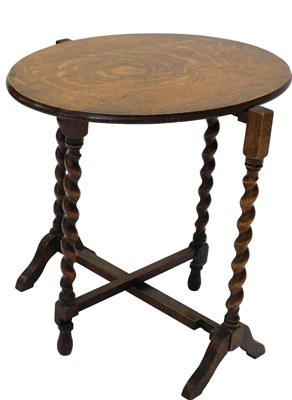 Lot 1000 - An oak occasional table, the circular top with...