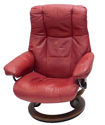 Lot 1004 - A Stressless red leather adjustable...