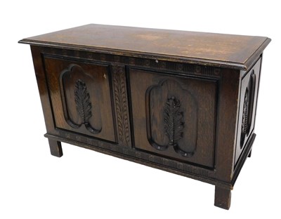 Lot 950 - An oak coffer, the hinged top with a moulded...